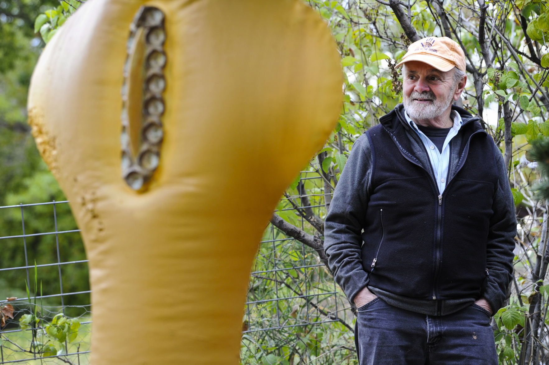 Clawson looks at his sculpture on a recent morning.